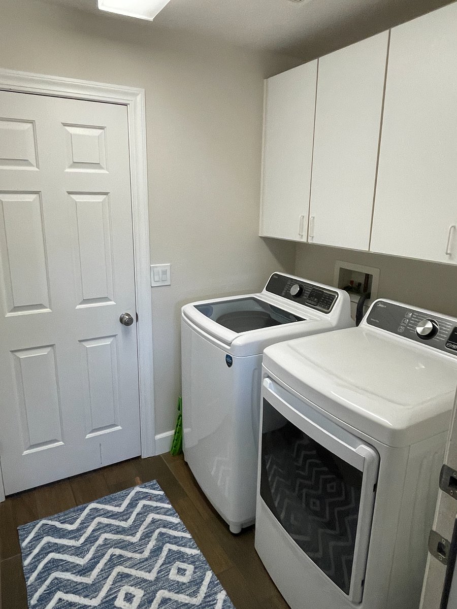 shared laundry room in main house with garage entrance