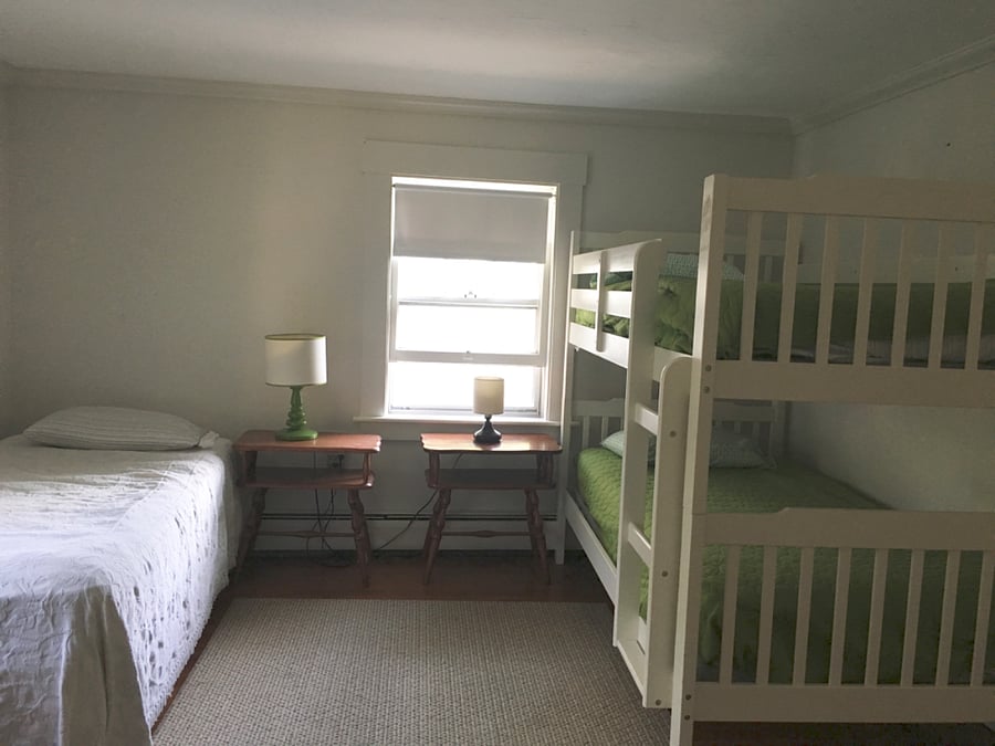 Bunk bedroom with single twin bed.