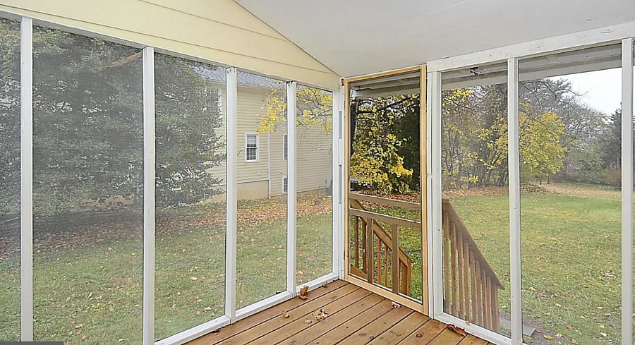 Private screened porch in backyard