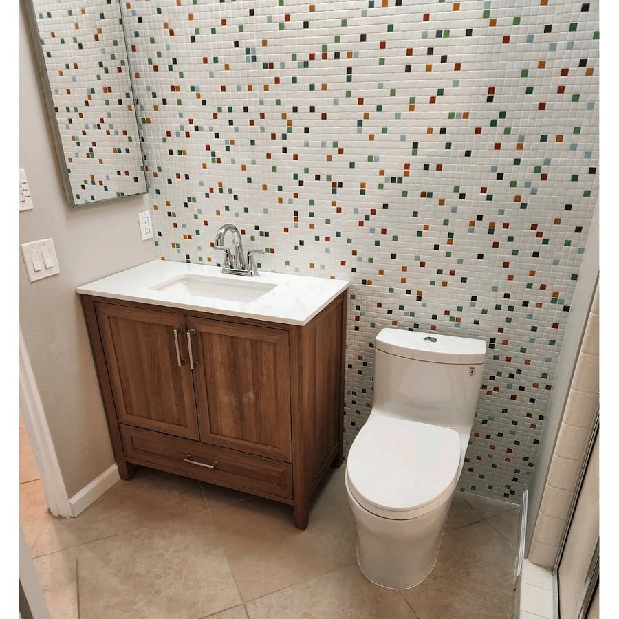 Guest bath with newly iremodeled backsplash. vanity & fixtures