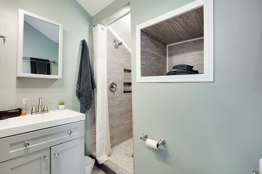 Bathroom with starter toiletries and bathroom linens for your convenience.