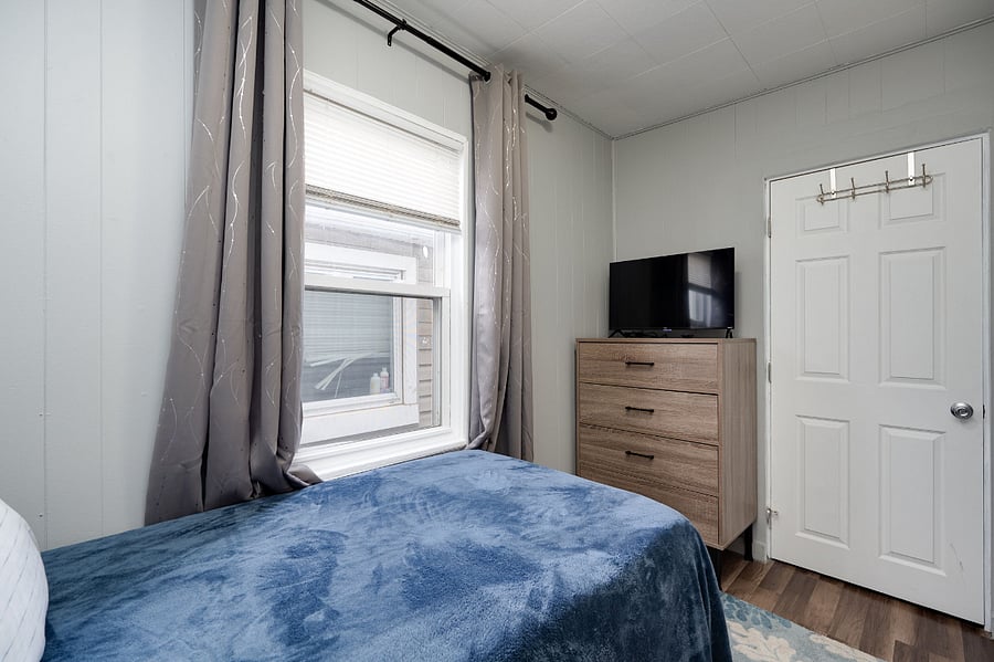 Second room also includes noise cancellation box fan and black-out curtains.
