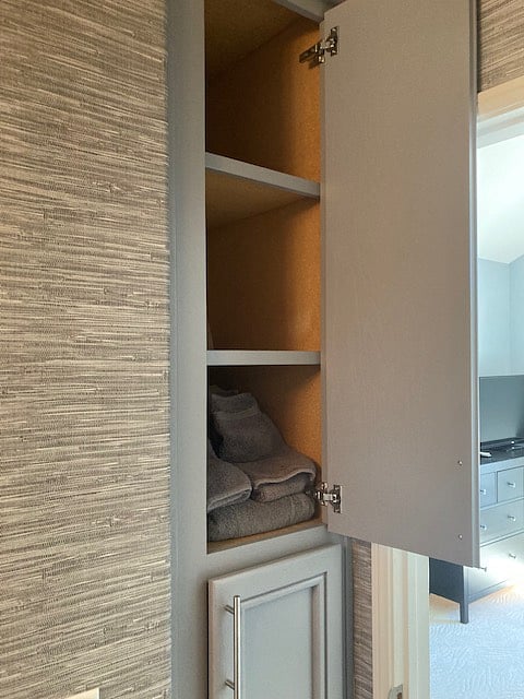 Linen closet in attached bathroom