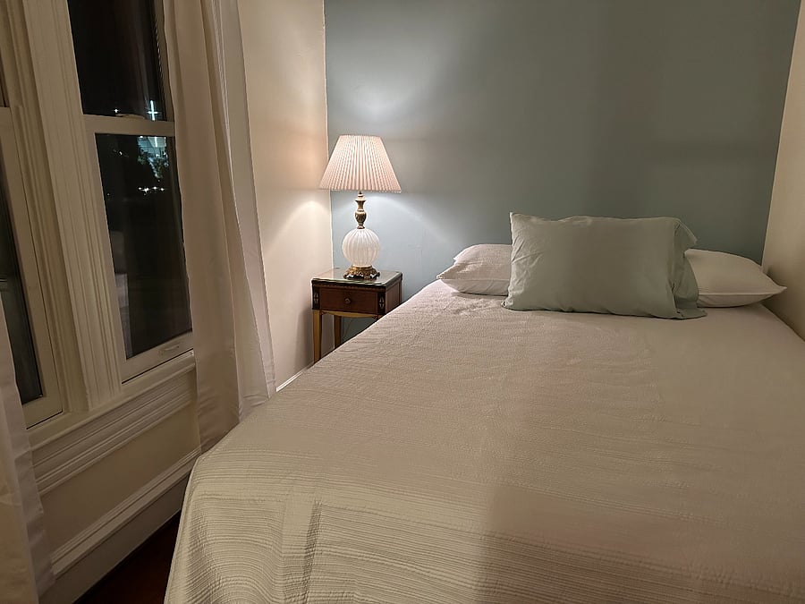 The bedroom has blackout curtains,
