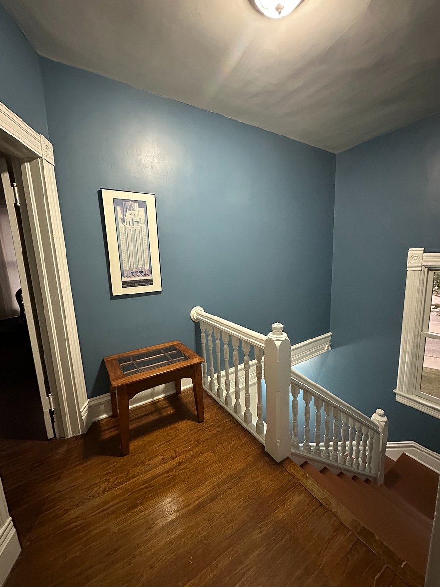 A convenient area to stash your keys, laptop bag, and more at the top of the front stairway.