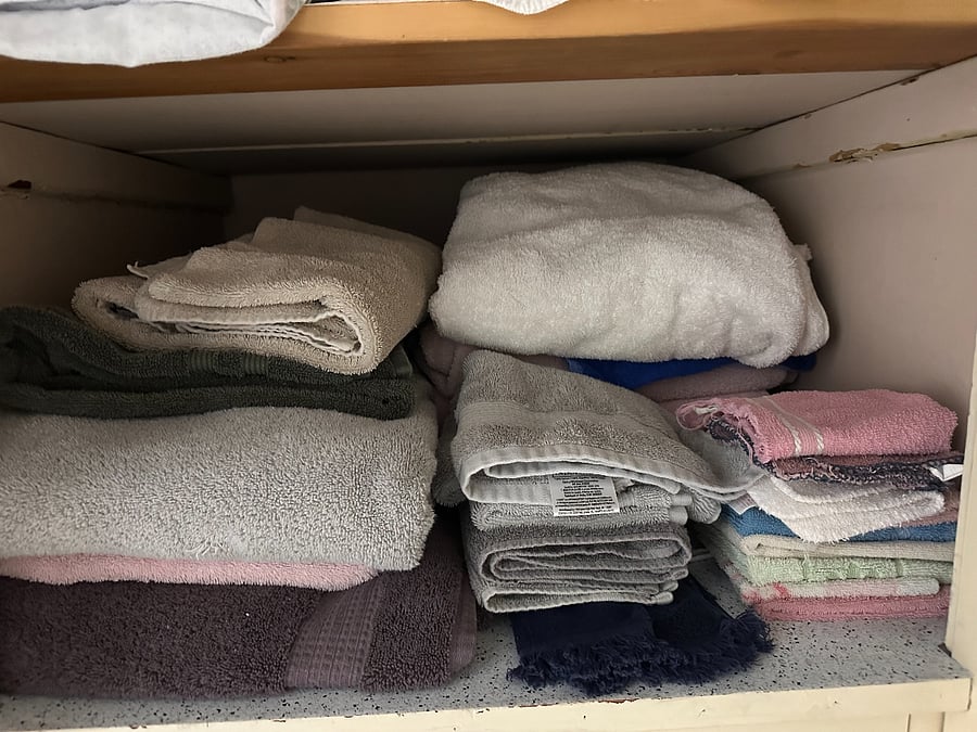 Linen closet. Each bed has two sets of sheets. There are four sets of bath towels, bath mats, kitchen towels, and hand towels.