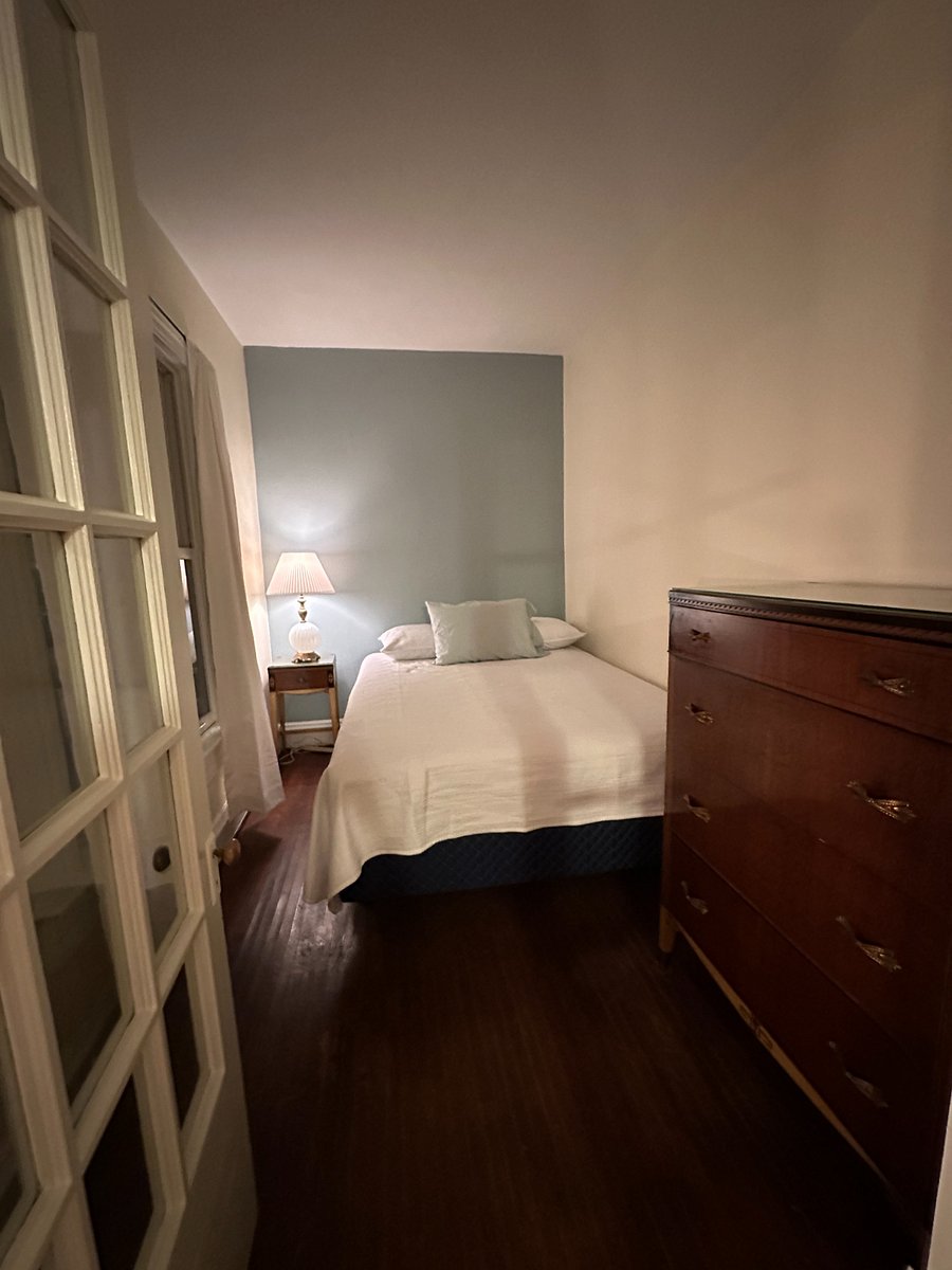 The bedroom has a night stand and a dresser. High quality matress. There is also a dresser in the closet.