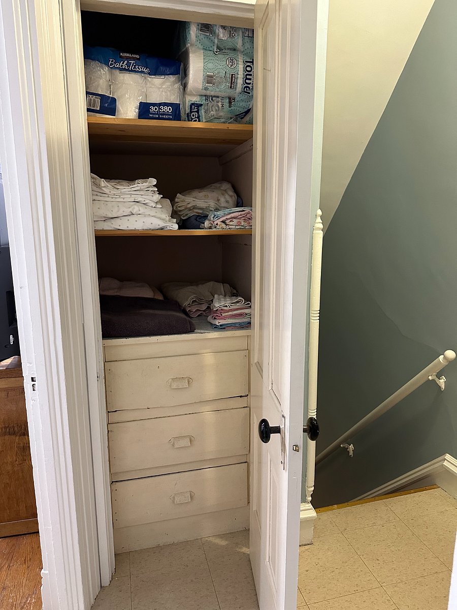 Linen closet at the top of the back staircase. Each bed has two sets of sheets. There are four sets of bath towels, bath mats, kitchen towels, and hand towels.