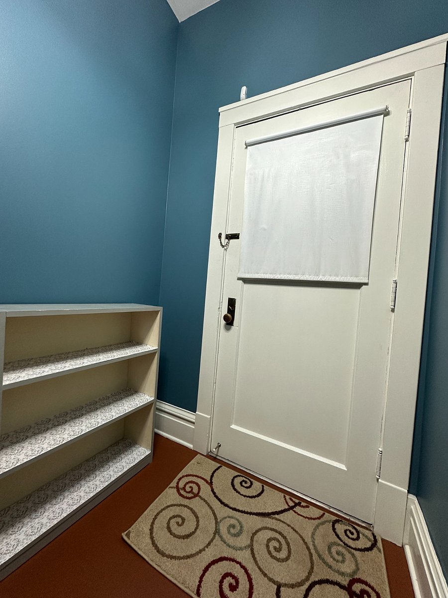 A place for shoes and bags by the front door.