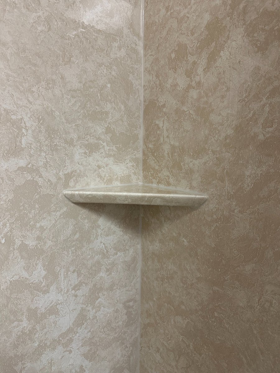 Bathroom with new shower surround and plumbing.