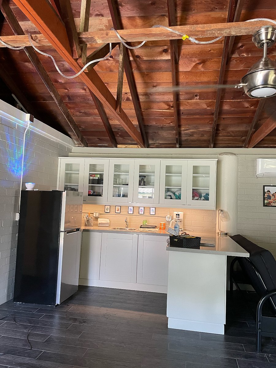 Kitchen area. Cooking equipment includes, microwave, air fryer and induction stovetop unit.