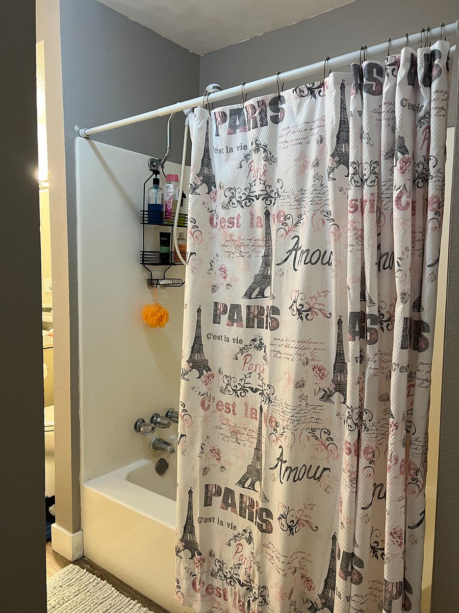 Full bathroom with shampoo, conditioner, body wash gel, etc.