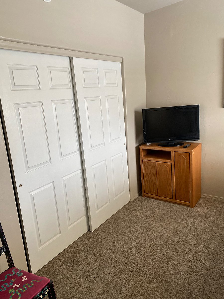 Guest bedroom tv and closet