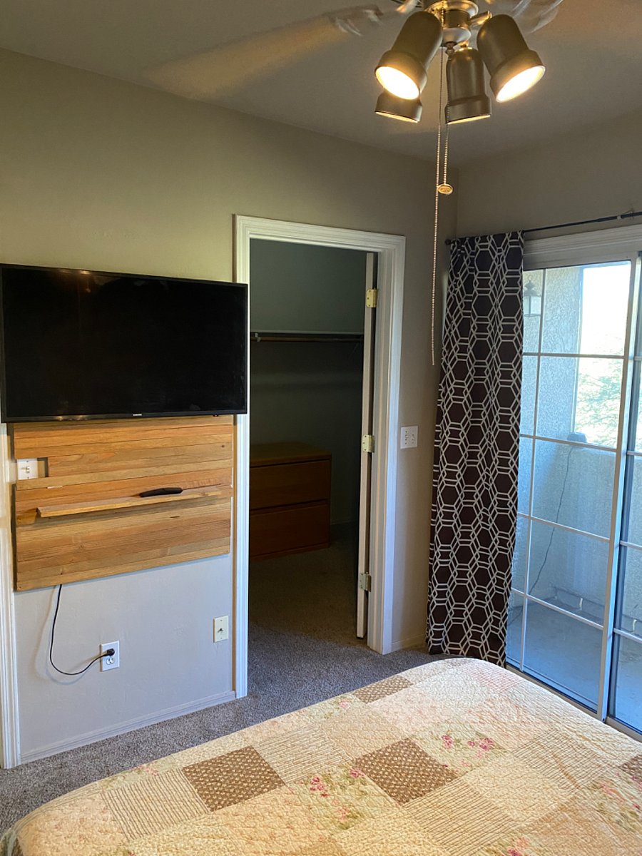 Master bedroom smart tv, walk-in closet, and balcony.
