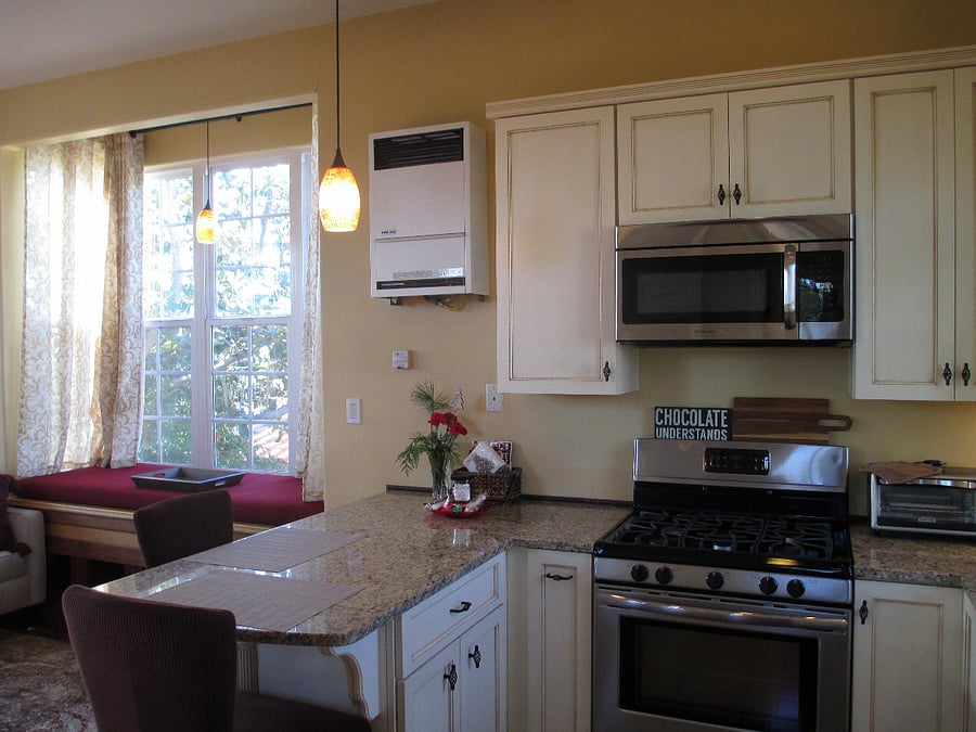 Granite countertop with plenty of room for food prep and dining.  