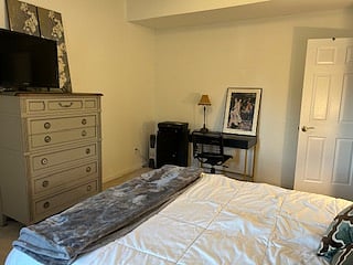 Bedroom with TV and desk