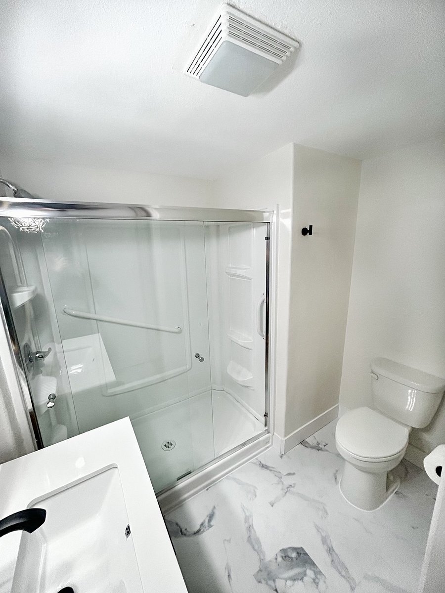 Bathroom with nice sized shower and vanity.