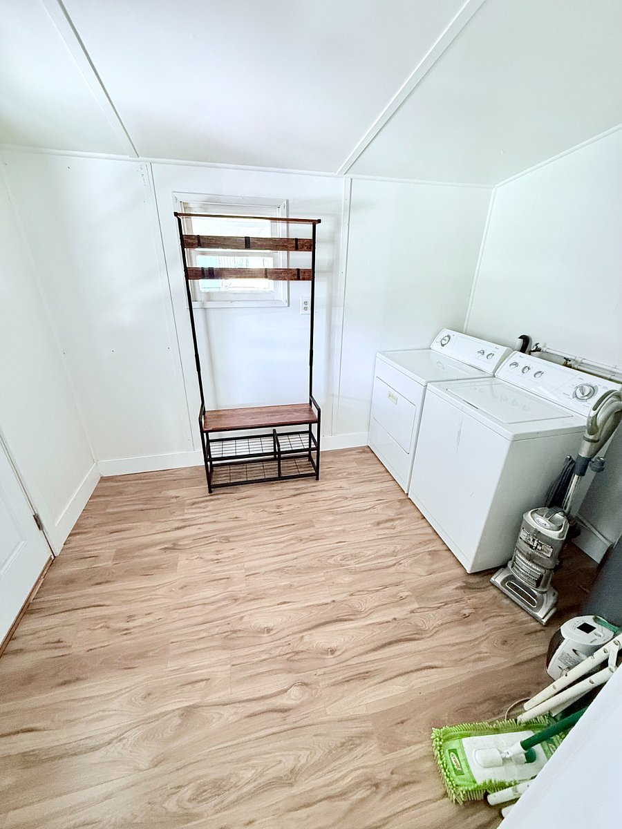 Mudroom hall tree in the laundry room with it's own entrance.