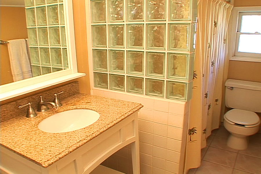 Second Bathroom off the hallway with tub and new shower.
