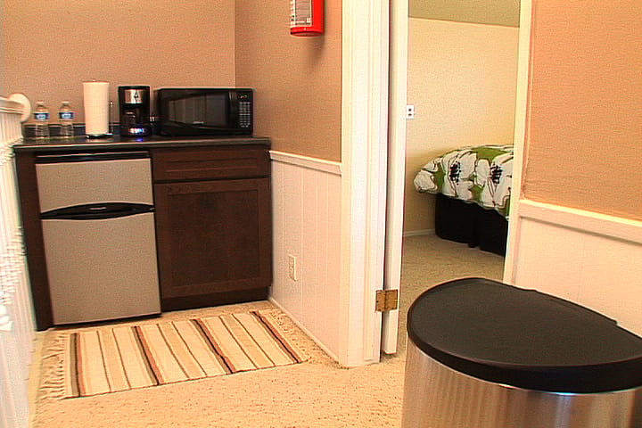Hallway additional kitchen accessories: under counter fridge with freezer, microwave, over counter toaster-oven (can accommodate a pizza, not pictured here).
