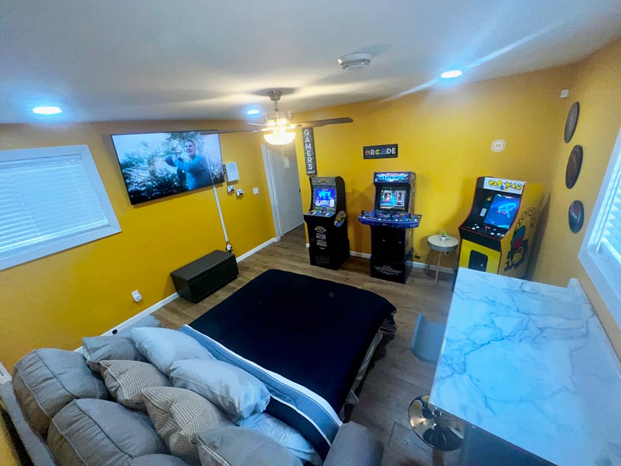 Arcade room + Queen Sofa bed. Pac-man game includes 14 games 1 cabinet, Street Fighter and NFL Blitz