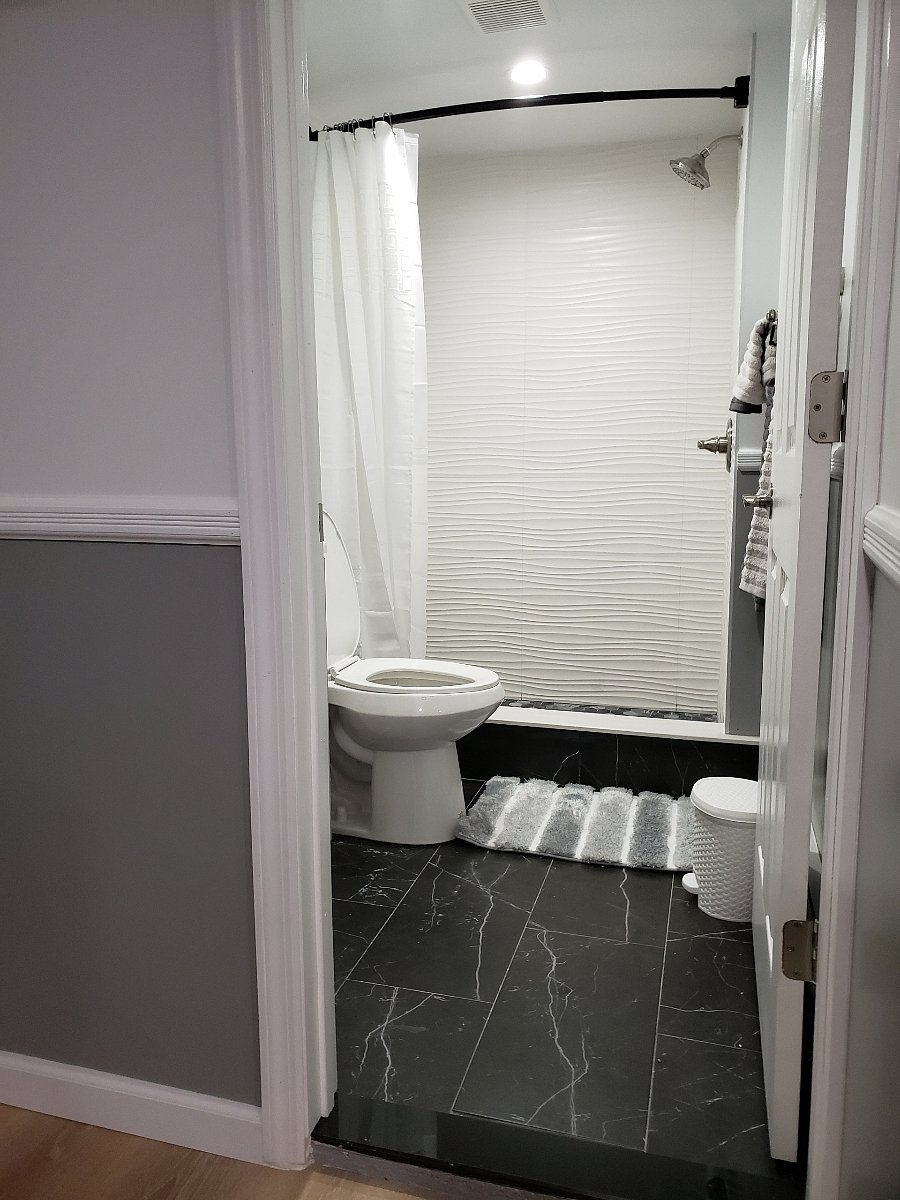 Fully Stocked Bathroom with Shower