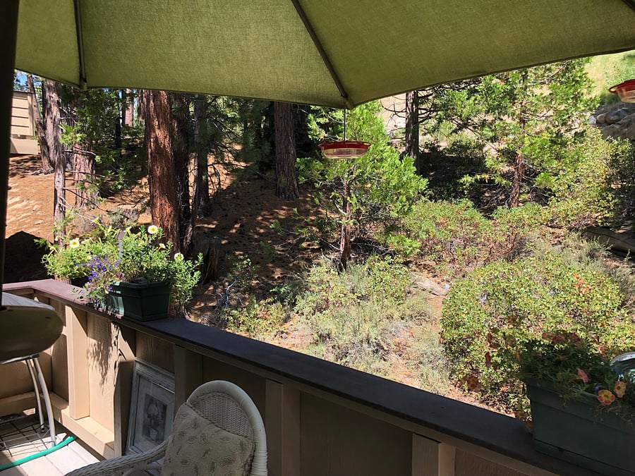 Deck backs up to hillside for more privacy