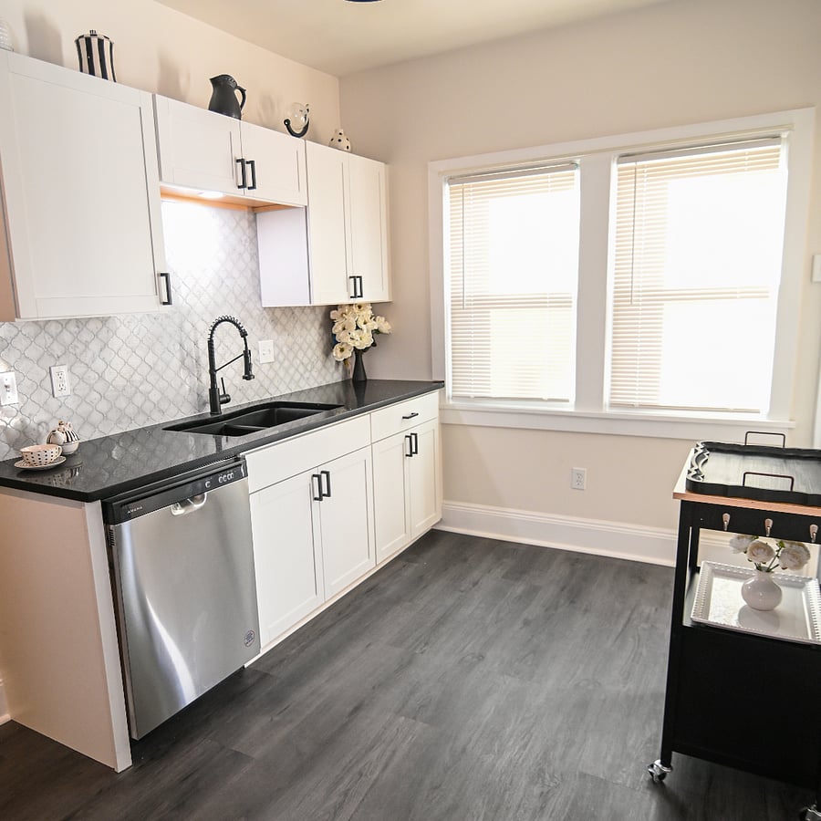 Newly remodeled kitchen with quartz countertops and stainless steel appliances