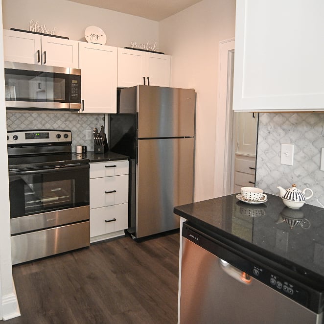 Fully stocked kitchen with dishes, glasses, utensils, pots & pans, crockpot, etc