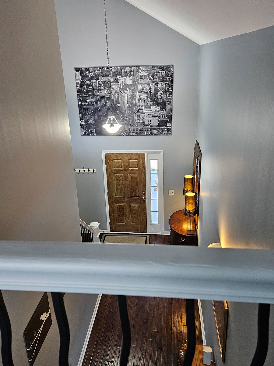 Upstairs view of front door and foyer
