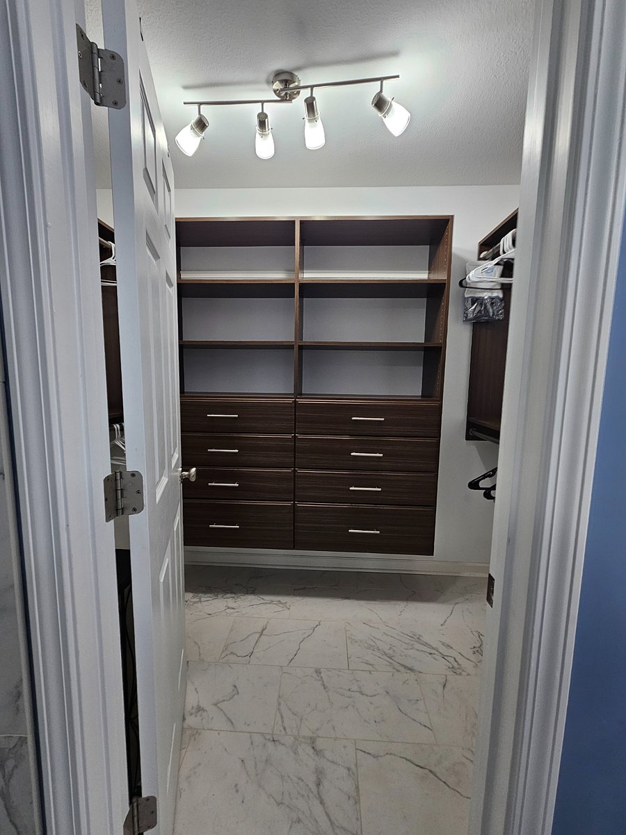 Primary bedroom walk in closet