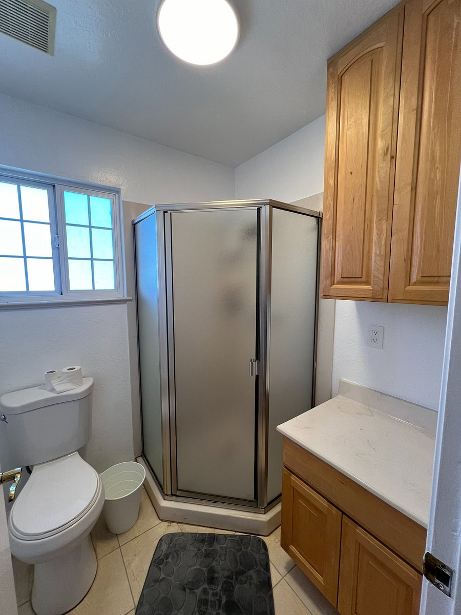 Shared bathroom- toilet and shower area are separate from vanity area.
