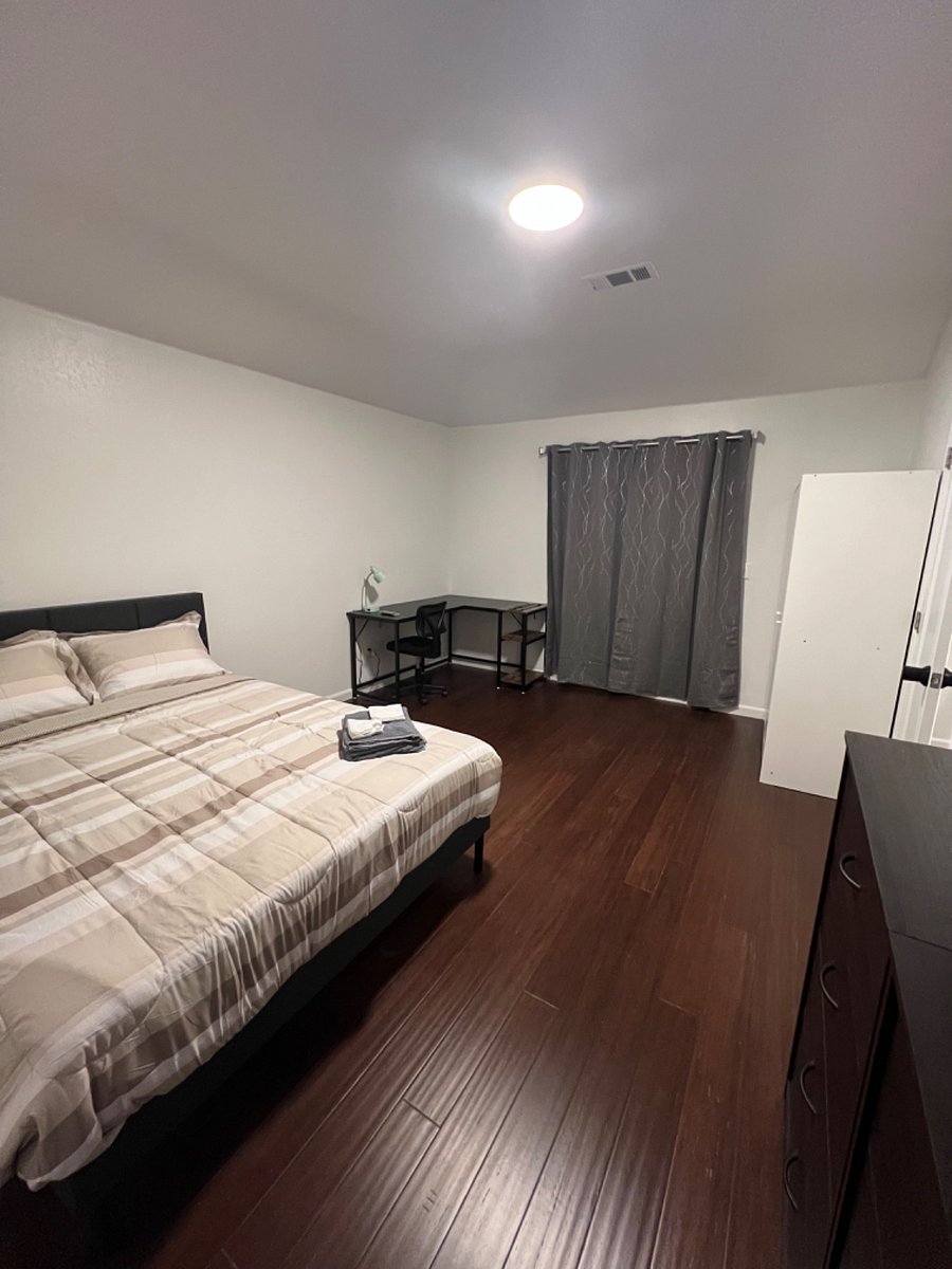 Bedroom 3- Queen size bed, 50" smart TV. office table, 2 dressers, wardrobe.