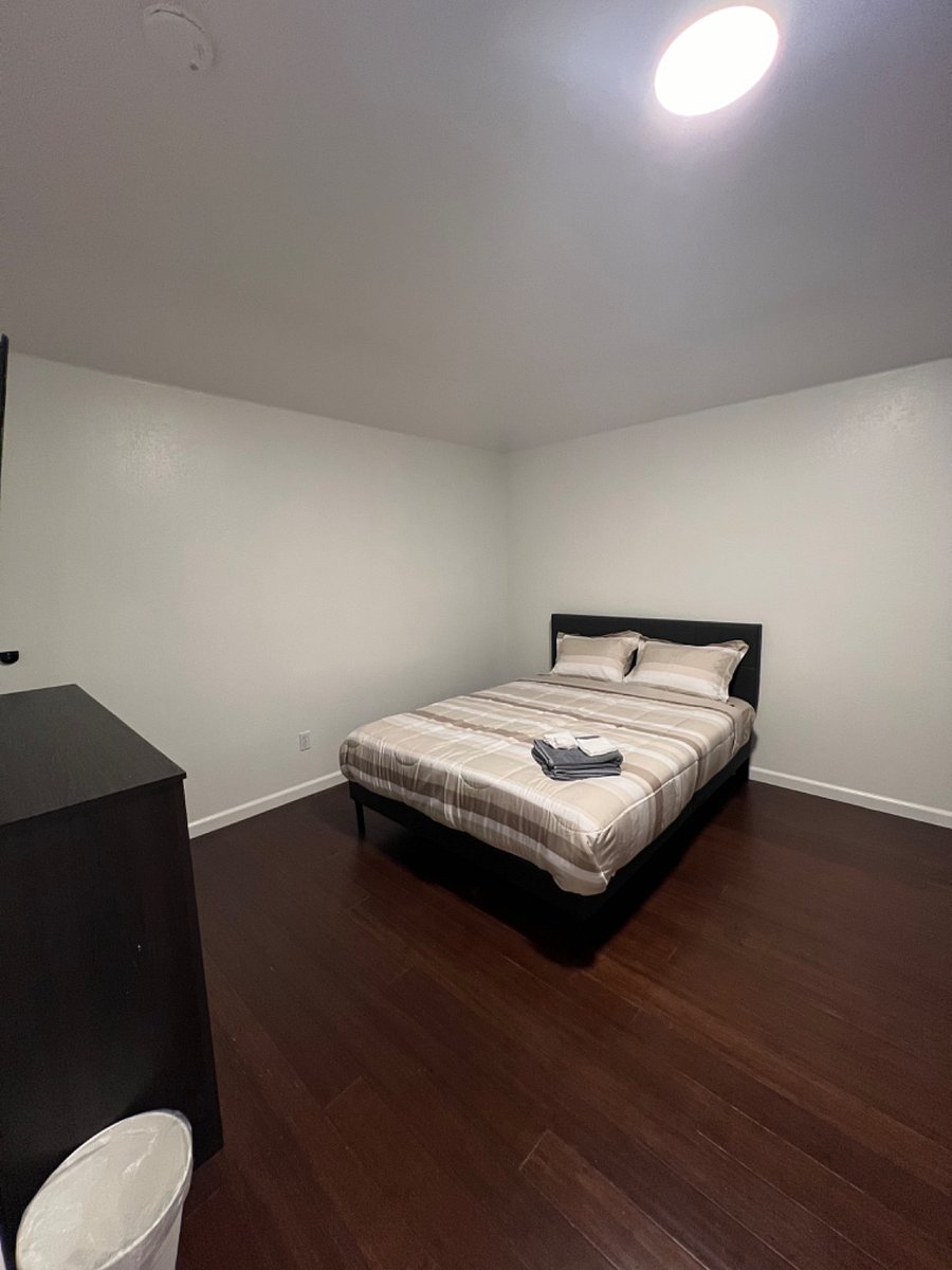 Bedroom 3- Queen size bed, 50" smart TV. office table, 2 dressers, wardrobe.