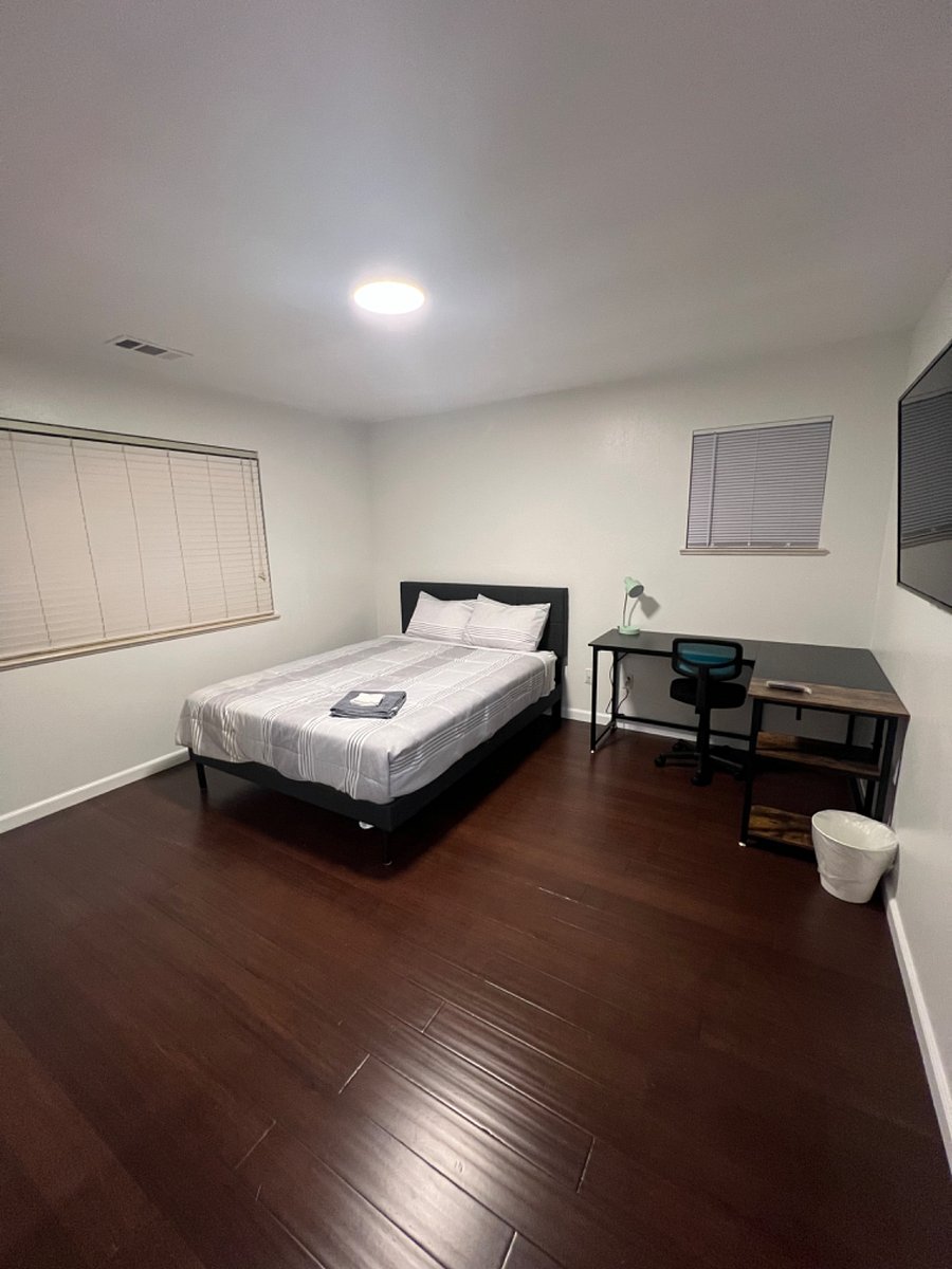 Bedroom 2- Queen size bed, 50" smart TV. office table.