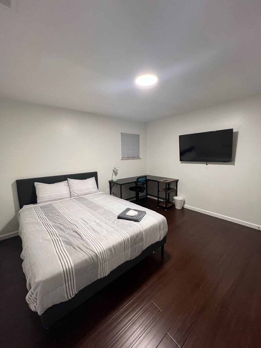 Bedroom 2- Queen size bed, 50" smart TV. office table.