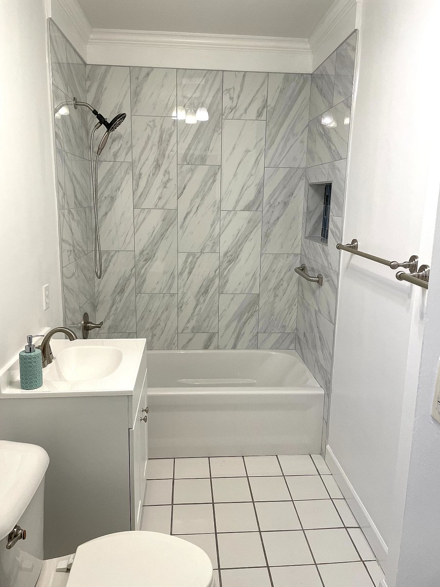 Newly renovated shower and tub, vanity and toilet