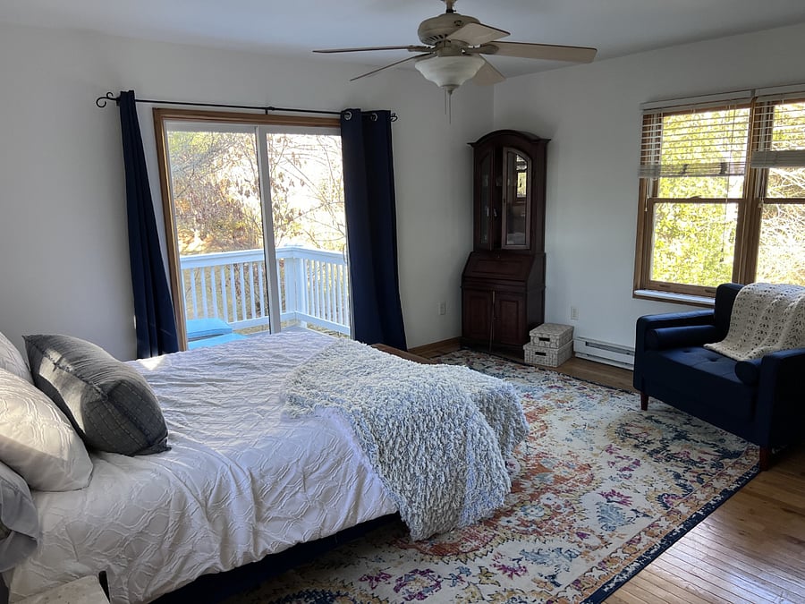 Upstairs bedroom #1 with private balcony, walk in closet, reading area and desk. Private bathroom across the hallway along with private living room upstairs.