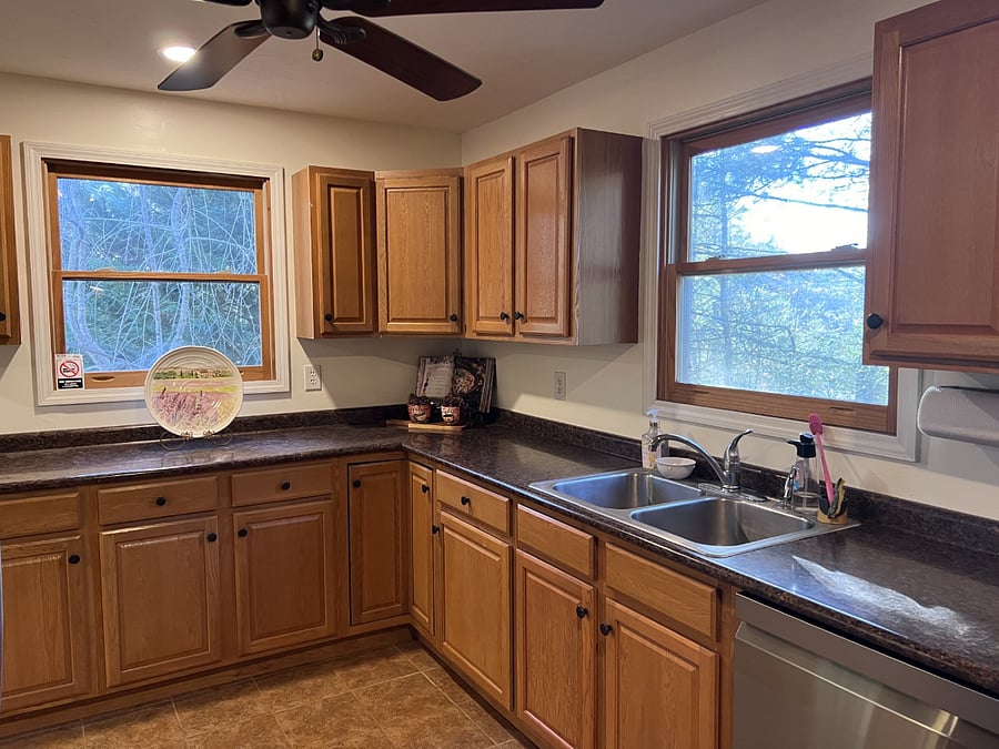 Large kitchen with new LG appliances.