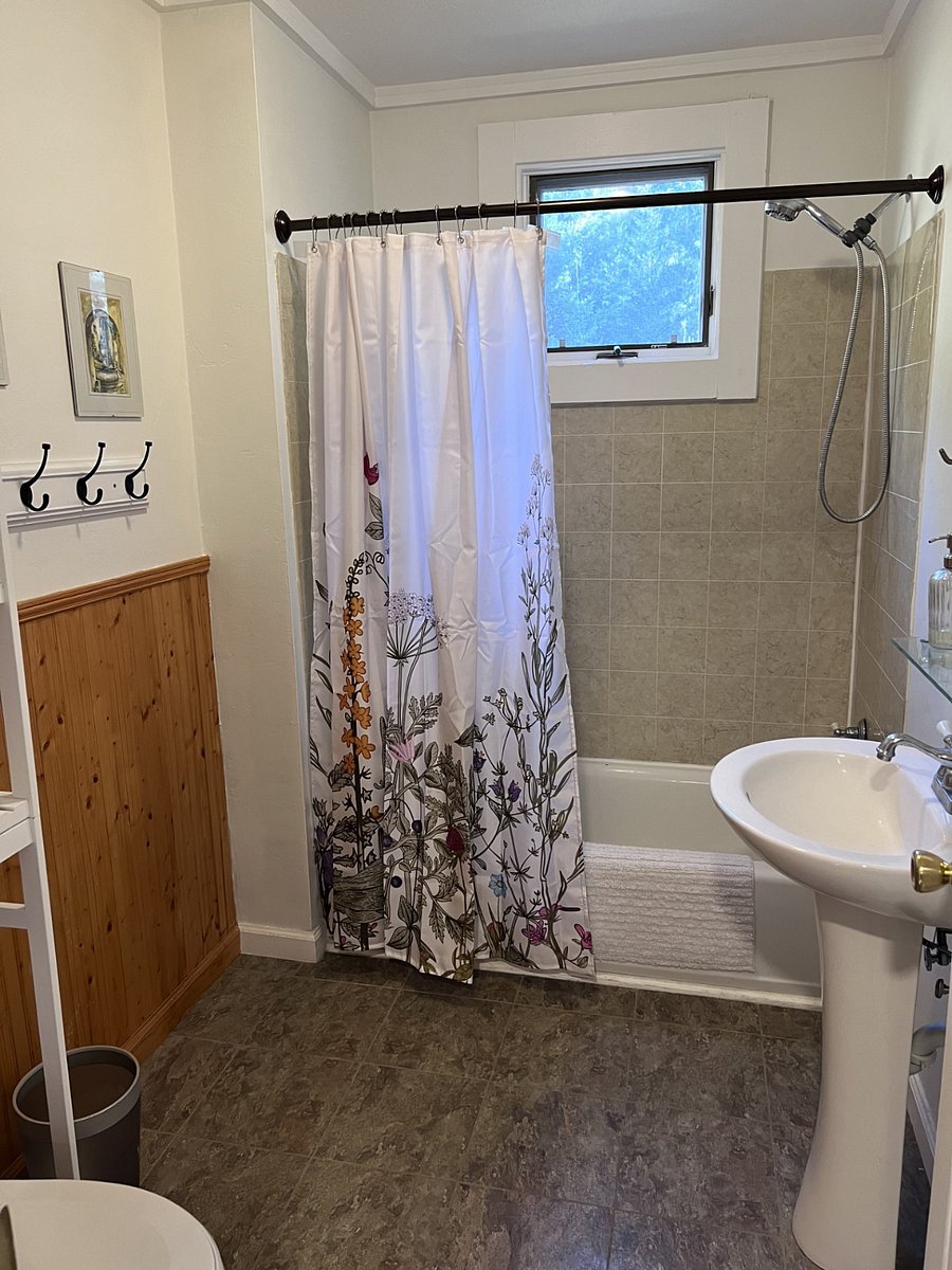 Downstairs full bathroom. Private to downstairs bedroom.