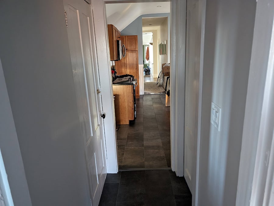 When you exit the bedroom, the door to your right is the bathroom and the door to your left leads to a stairwell that is your own private entrance/exit. It also leads to the basement where we have ample storage for you to use. Straight ahead is the kitchen.