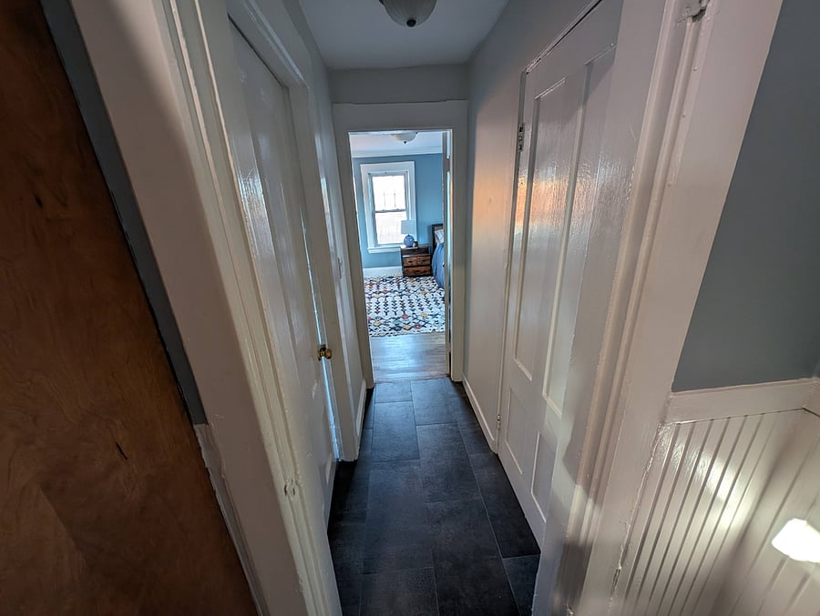 This is a view from the kitchen. There is a door at the beginning of this white hallway that separates your bedroom/bathroom/entrance from the rest of the condo