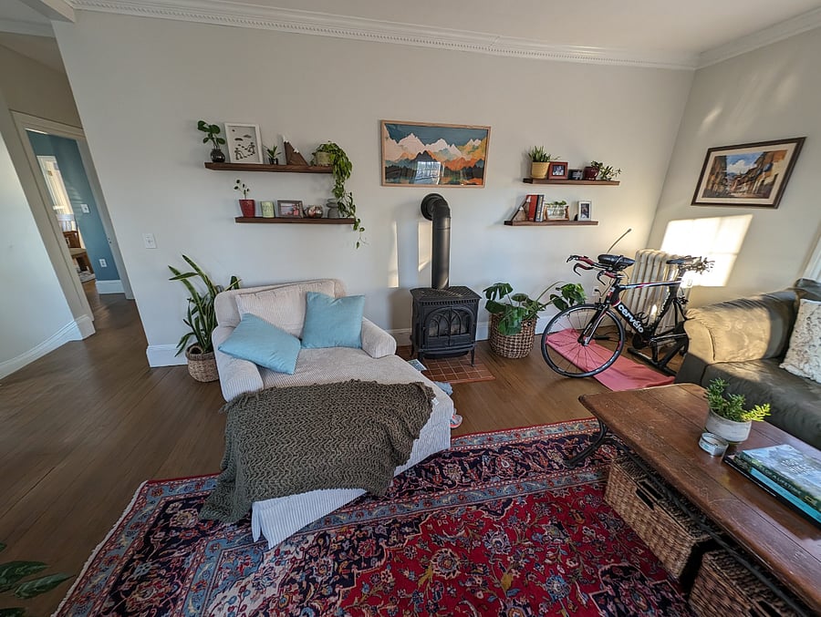 To the left, you can see into the dining room and the hallway that leads down to the kitchen