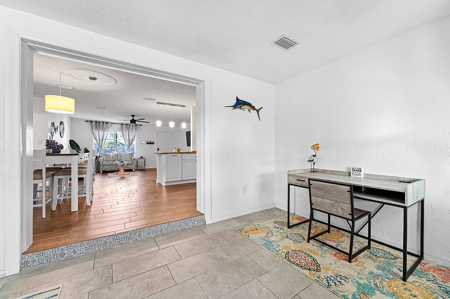 office space-desk, couch, smart TV that serves as second monitor, overlooking peaceful huge fenced in yard. 