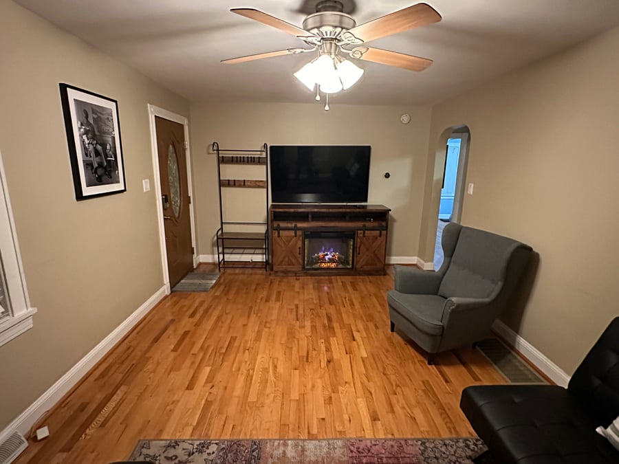 Furnished living room opposite door view