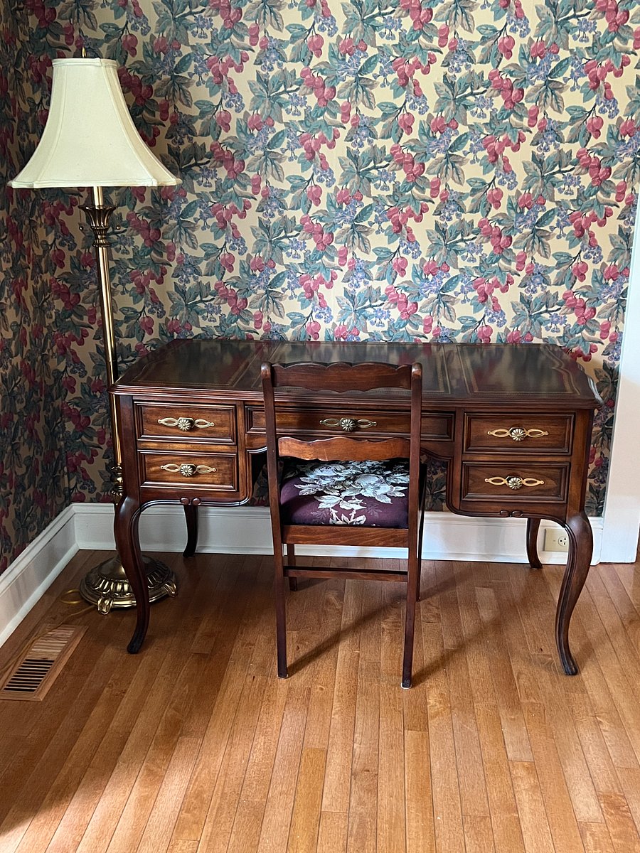 Desk and chair with a lamp. 