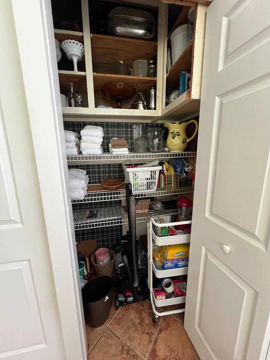 All the essentials "plus" can be found in this closest. Power strip, scisssors, tape, post-it notes, pens, tools, replacement batteries, battery operated lamp, flashlight, light bulbs, extra cleaning supplies, etc. On the other side of this closet is the washer and dryer. 
