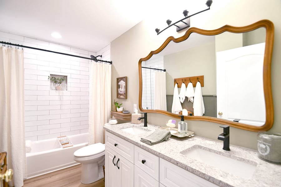 Generous bathroom with tub/shower combination and 2 sink vanity