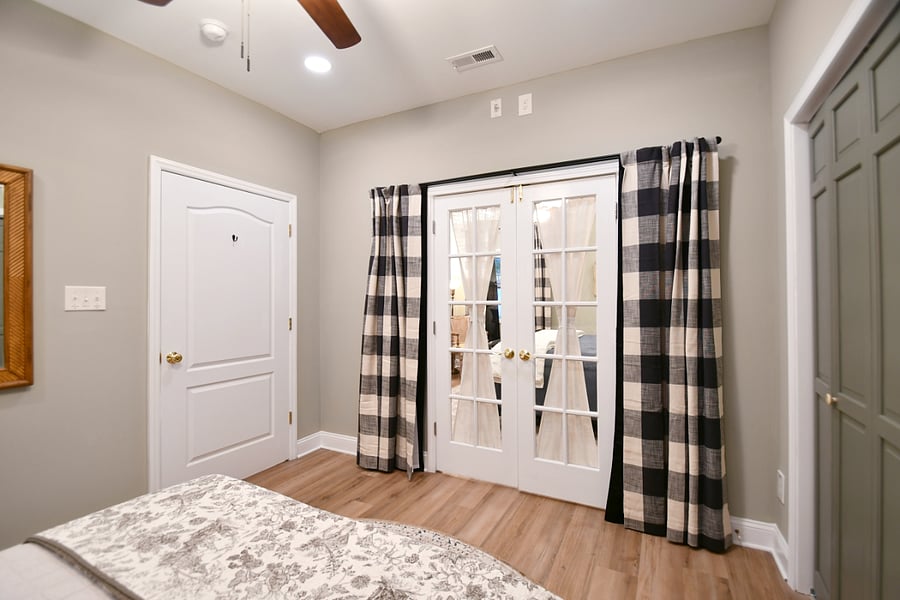 The 2 bedrooms are adjoined by French doors that have blackout curtains to be used as needed