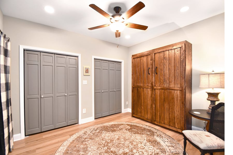 Murphy bed is easily stowed away if a single renter wants to use this room for a designated workspace (desk is stored nearby) or exercise area.